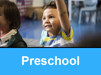 Preschool button with student raising his hand in class