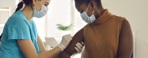 Young African-american Woman Getting Seasonal Influenza Shot Or